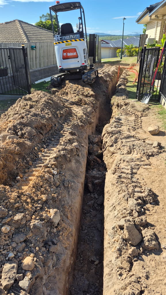 Deep utility trench cut by 2t excavator
